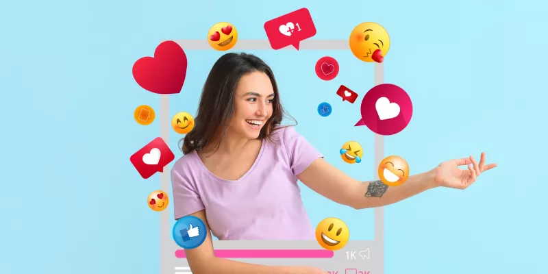 A foto mostra uma mulher tirando uma selfie. Ao seu redor estão diversos ícones de emojis.